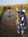 SX11265 Lib, Annie, Matt and Jenni walking through icy puddle.jpg